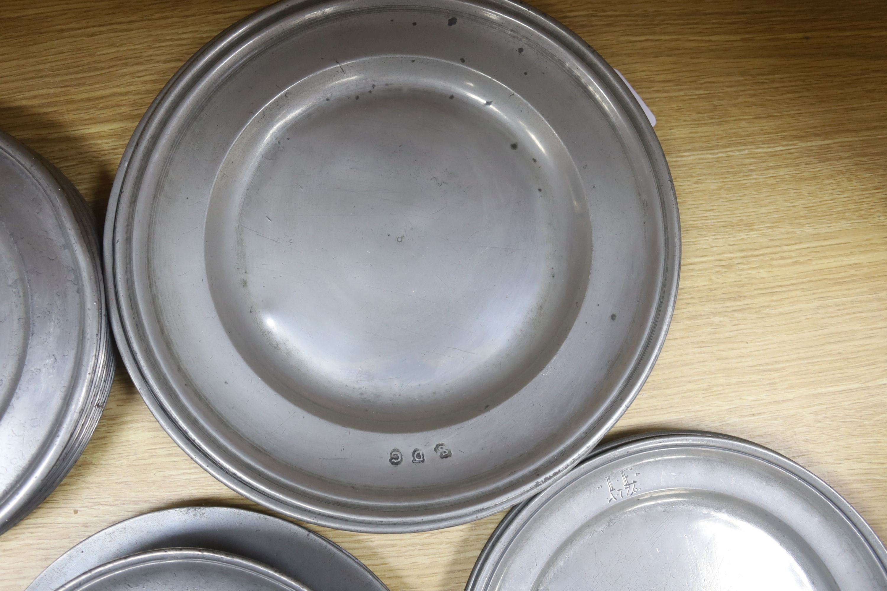 18th century pewter flat wares - a set of eighteen pewter plates by Henry Maxted, 9in. and 10in., two dishes by Daniel Collier and GBG, 12in., two Robert Bush plates stamped Redlynch house, 9.5 inches, a bowl with broad
